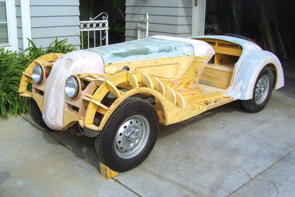 The body dimensions were scaled up from a die-cast model and then recreated in both cardboard and plywood.