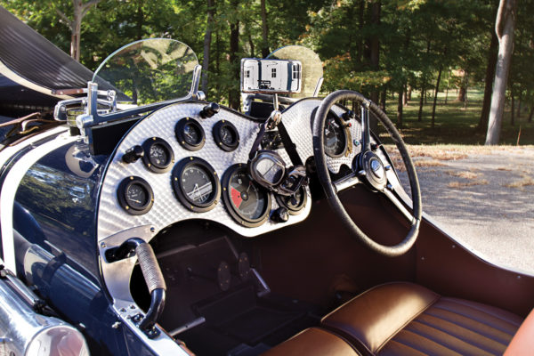 The classically styled cockpit recalls the era when goggles were required driving attire.