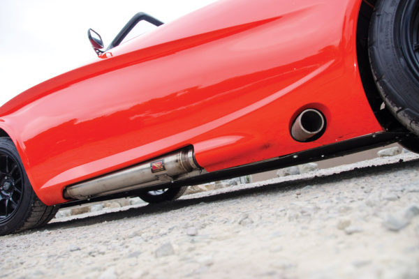 A motorcycle exhaust gives the turbo’d Miata mill a fierce note.