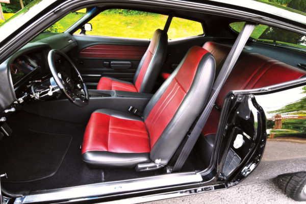 The interior was done by Shawn Krist from Krist Kustoms in Fort Wayne, Indiana. He chose bucket seats from a 1969 Mach 1 for up front and retained the factory rear seat. He covered both in a combination of black and antique mahogany leather.