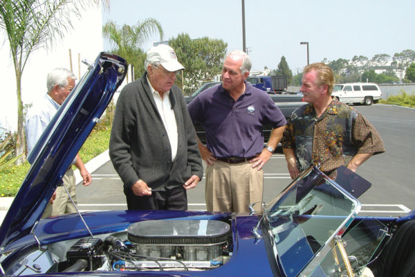 Carroll Shelby (left) visited with Bob Funari (center) to check out his cammer Cobra and other performance cars in his collection.