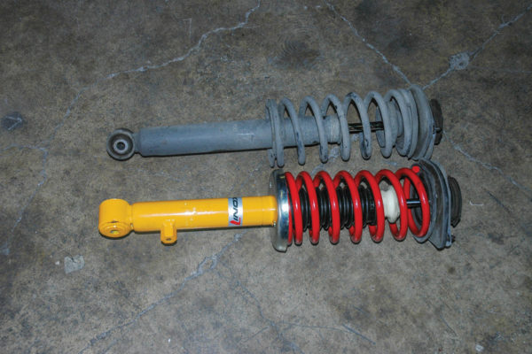 This is a stock Miata spring-and-shock unit and a KONI Sport Adjustable replacement. The KONI allows you to set damping, change the spring and offers two ride heights based on the mounting of the lower spring perch.