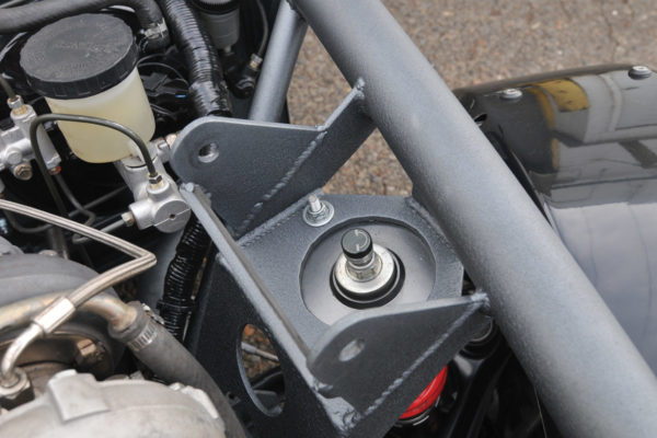In a custom-built car, the builder can make access to the strut as easy as possible for adjustment and for spring replacement. But to get correct spring rates on a custom-built chassis, you’ll need to know your corner weights.