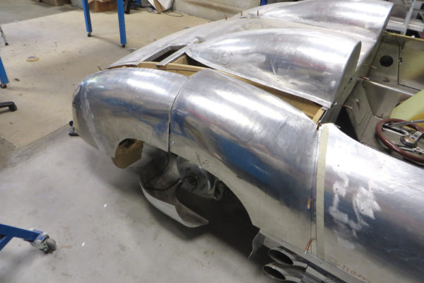 Once shaped, the rear quarter panels are fitted over the wooden buck. When creating individual component panels, it’s better to make the panel breaks over a section of buck, so two adjoining panels can be screwed to the buck prior to tack welding.