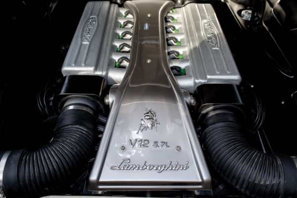 A Lamborghini-style V12 cover conceals the LT1 V8 underneath.