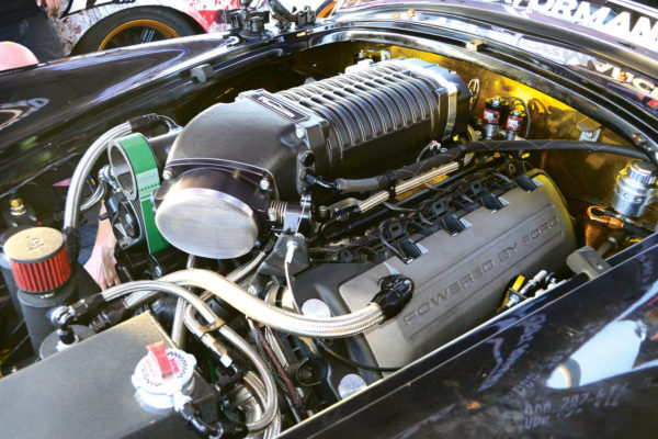 This particular Ford Coyote crate engine has a lower compression ratio to accommodate the extreme levels of forced induction from the blower and nitrous.