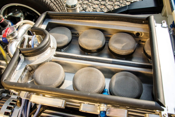 Induction flows through four TWM two-throat electronic fuel injection throttle bodies with the same footprint as the original’s Weber 48 IDA carburetors. The setup is modernized with EFI using Holley’s HP ECU and MSD Pro-Billet Dual Sync distributor.