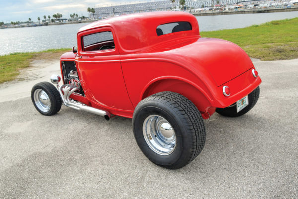 A Ford 9-inch axle with four-link geometry, coilover shocks and disc brakes keep the rear end stable.