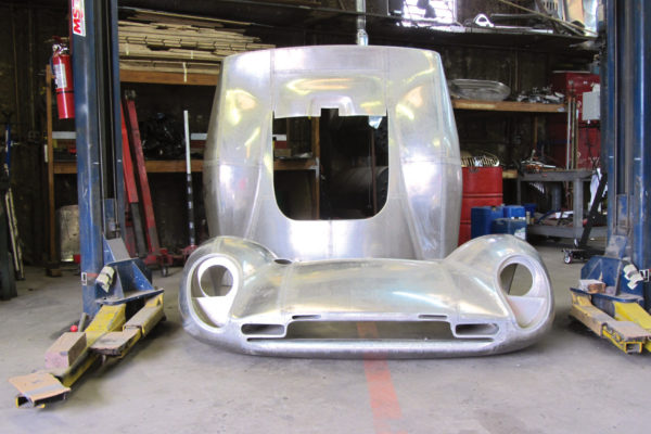 The aluminum body was initially shaped on a wire-frame buck, but is now shaped on a fiberglass male mold.
