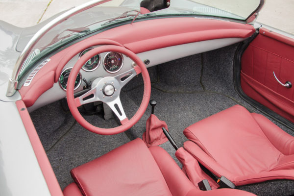 Red leather upholstery livens up the subtle Arctic Silver paint scheme.