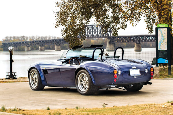 Rather than Raydot mirrors mounted on the front fenders, as was done on original Shelbys, the mirrors are closer to the driver, on the windshield frame.