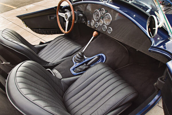 The dash echoes the modern composite body material, and the gauges are new AutoMeter units.