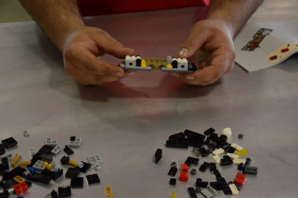 While most GT40 kits are based on a space frame and/or monocoque chassis design, our Lego GT uses a pair of ABS plastic bulkheads that we joined in the center during this step. 
