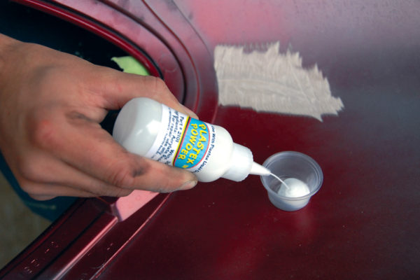 For smaller damage, or vertical surfaces, first squeeze some powder into a small cup (provided in the kit).