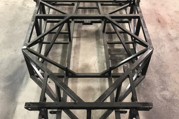 The foundation of the Quest is a space frame with a 93-inch wheelbase, which will be fitted with a C4 Corvette suspension. John Chesnut built a jig from a C4 Corvette tub that he had turned upside down.