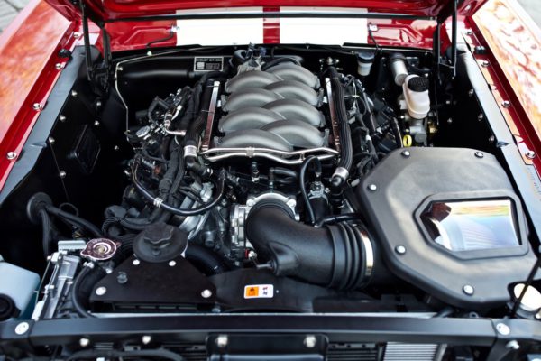 Revology Cars made a considerable investment to rework its Mustang continuations for current model-year powerplants like this Gen 3 Coyote 5.0-liter (2018 and up).