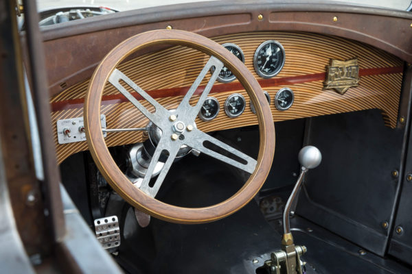 The steering wheel and hub was custom fabricated by Rusch, and fitted to an aftermarket column.