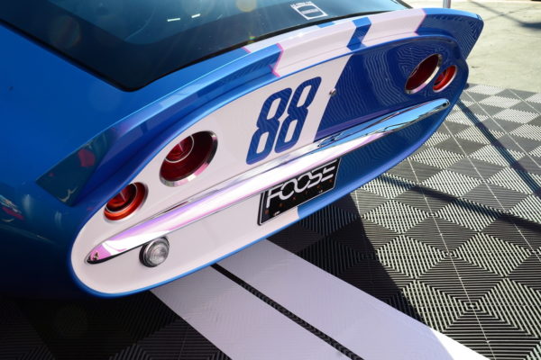 Peter Brock and Chip Foose were on location to unveil this Superformance Daytona Coupe makeover. The car is equipped with unique bumpers, as well as many significant additions for its female pilot, such as the flowers incorporated in the stripes.