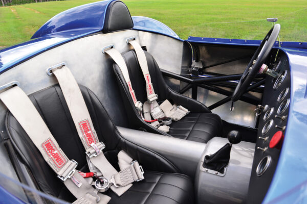 A portion of the Scarab’s tubular space frame is visible in the sides of the aluminum cockpit.