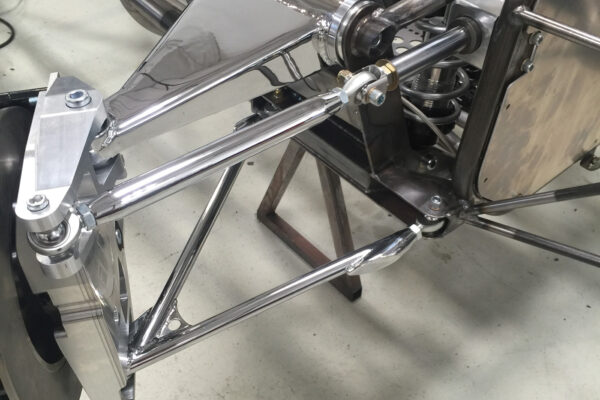 Is that a beautiful suspension piece or what? It would look right at home on a high-end street rod. Note the rocker arm arrangement (top center) for the coilover shock.