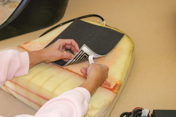   Once the pads are positioned where you want them, and trimmed if necessary, the adhesive along each side can be exposed to hold them in place on the foam. Rostra Precision Controls cautions not to trim the cushions vertically, as that might cause dead spots in the pads and could cause overheating.