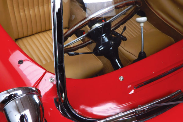 From this angle, the interior is pure postwar Italian, with its wood-rim wheel, big tachometer, ivory gear knob, etc.
