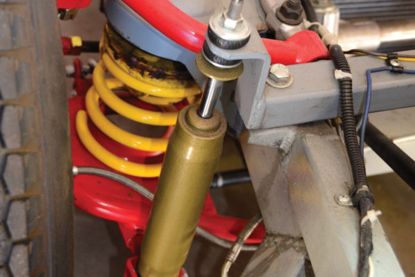 The coil-and-shock front suspension has a setup similar to the original from the 1950s, but with updated components. Note the special adjuster on top of the upper mount for the coil spring.