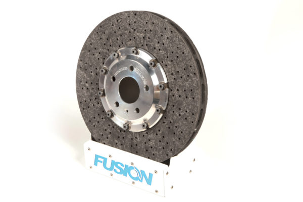 This Carbon Ceramic Brake is produced by Fusion Brakes for high-performance vehicles. Claimed to have no brake fade, more than 50 percent in unsprung weight reduction, and four times the life, these brakes offer many advantages over traditional iron discs. 