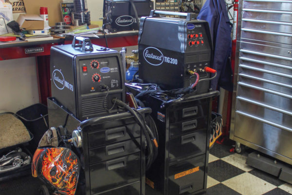 Part of my collection of Eastwood tools are these welders and plasma cutter. The MIG 175 wire-feed welder (left) is used extensively, while the TIG 200 (right) is still undergoing training for its operator (that’s me). Also seen in this photo are an upright stainless rollaway toolbox and wall-mounted Craftsman steel cabinets.