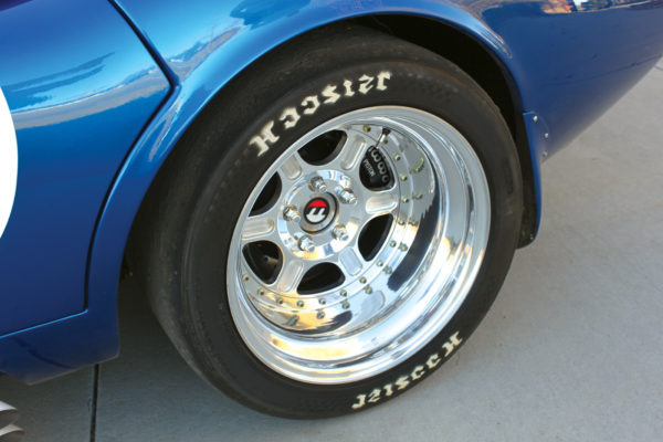 Much bigger rubber than original is mounted on the Bogart racing wheels, 335/35-17 Hoosiers.