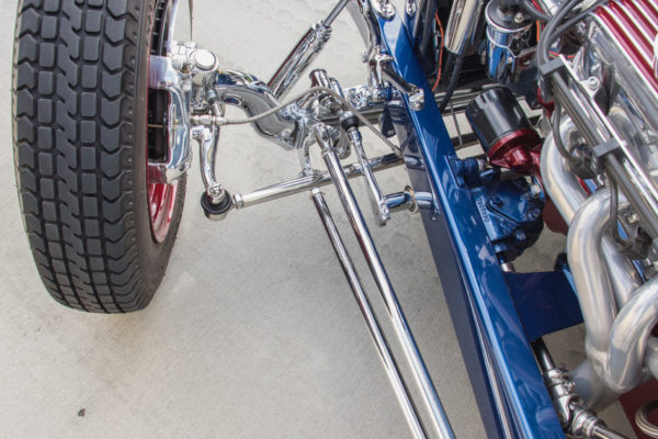 A Super Bell I-beam 4-inch drop axle and hairpins create the
right stance, while stopping power is provided by four-wheel
Wilwood discs. 